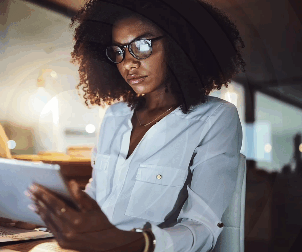 Young black woman on tablet insider risk management